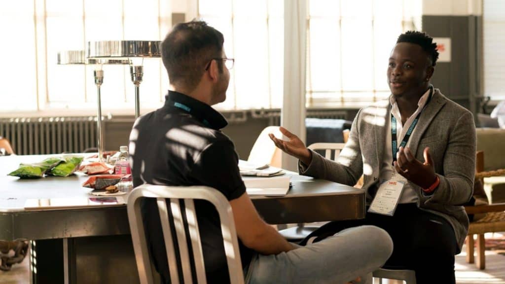 Two colleagues in a discussion over lunch